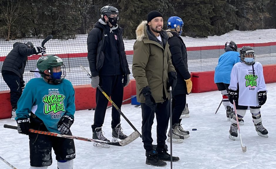 Minnesota Wild defenseman Matt Dumba, center, encourages kids at The OVAL in Roseville.