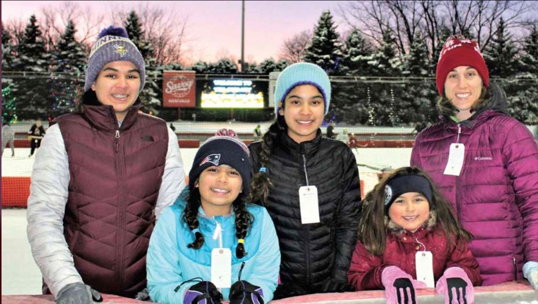 Five ice skaters pose for a picture at the Guidant John Rose MN OVAL.
