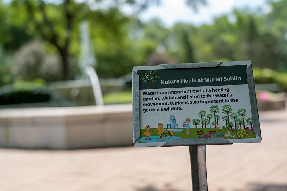 A sign near the water fountain at the Healing Garden talks about the sounds of water.