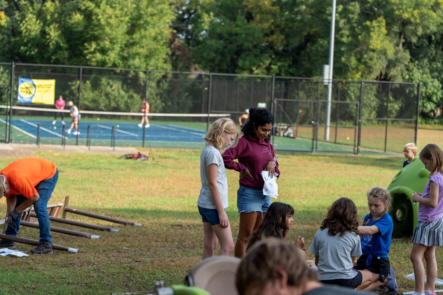 Neighborhood volunteers help build the new playground at Keya Park.