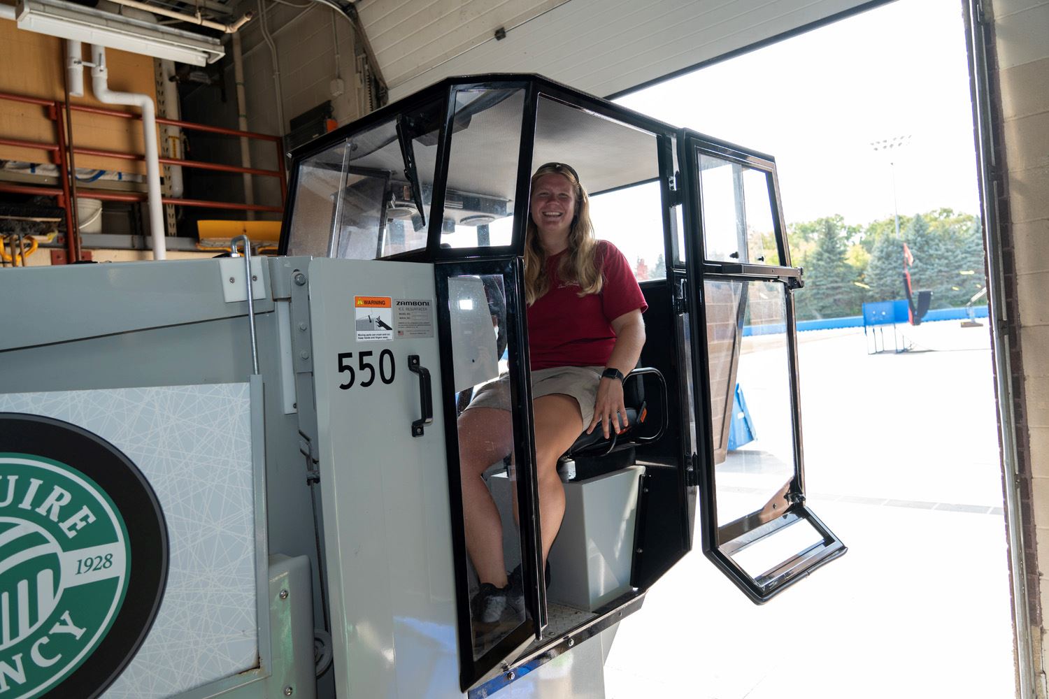 Taylor Driesen smiles for a picture on the Zamboni.