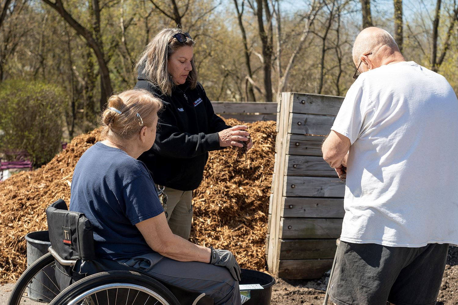 Volunteers work at the Muriel Sahlin Arboretum.