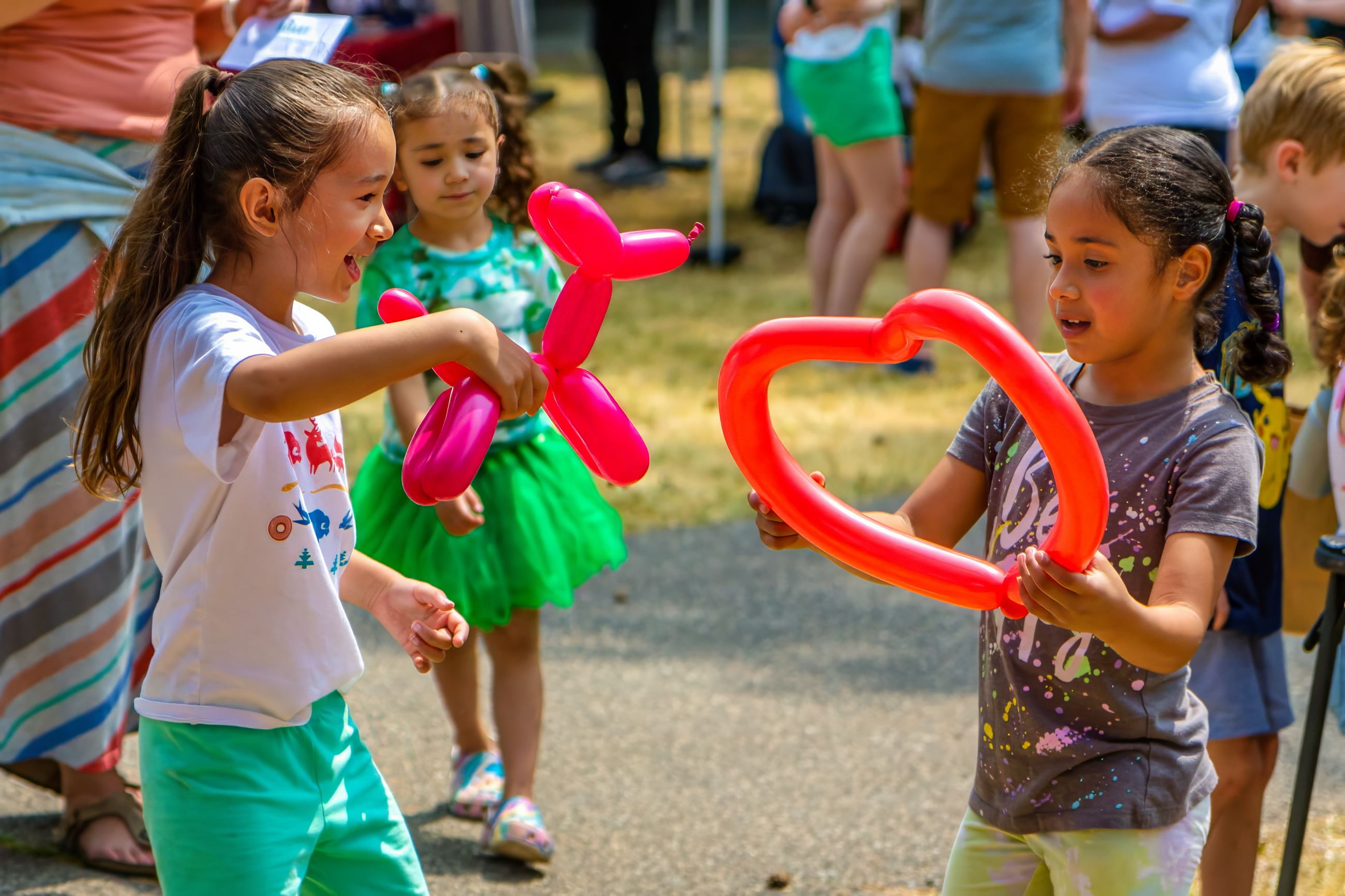 Children play with balloons at Juneteenth.