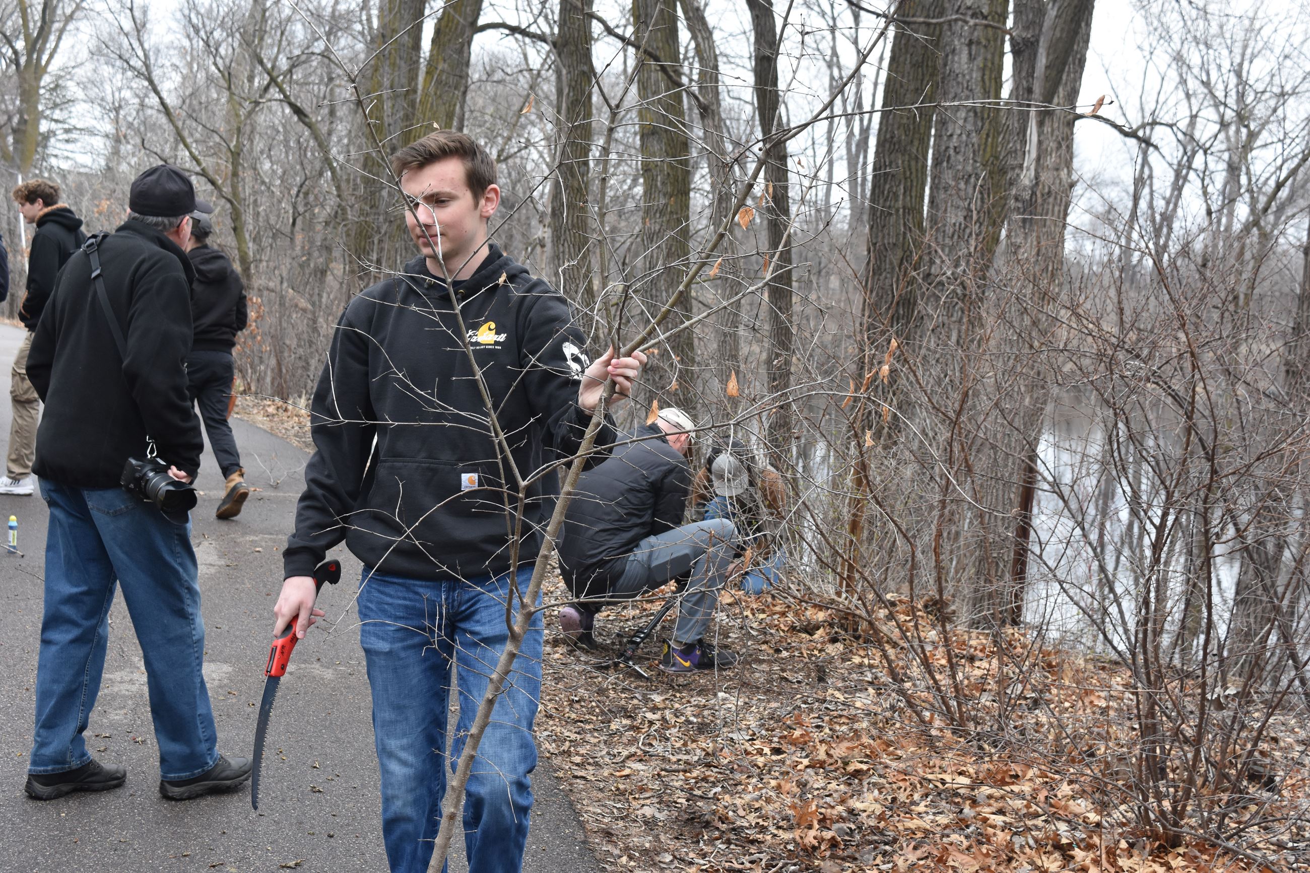College students remove buckthorn at Langston Lake