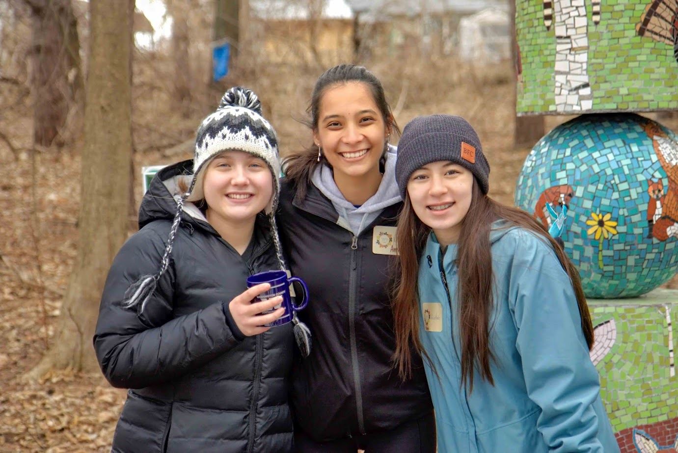 Volunteer Murphy Bloor, far left, and friends volunteer at Harriet Alexander Nature Center.